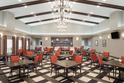Bright dining room with tables and chairs