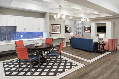 Bright common area with seating and dining space
