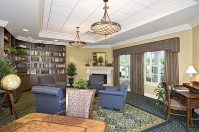 Cozy common area with seating and bookshelves