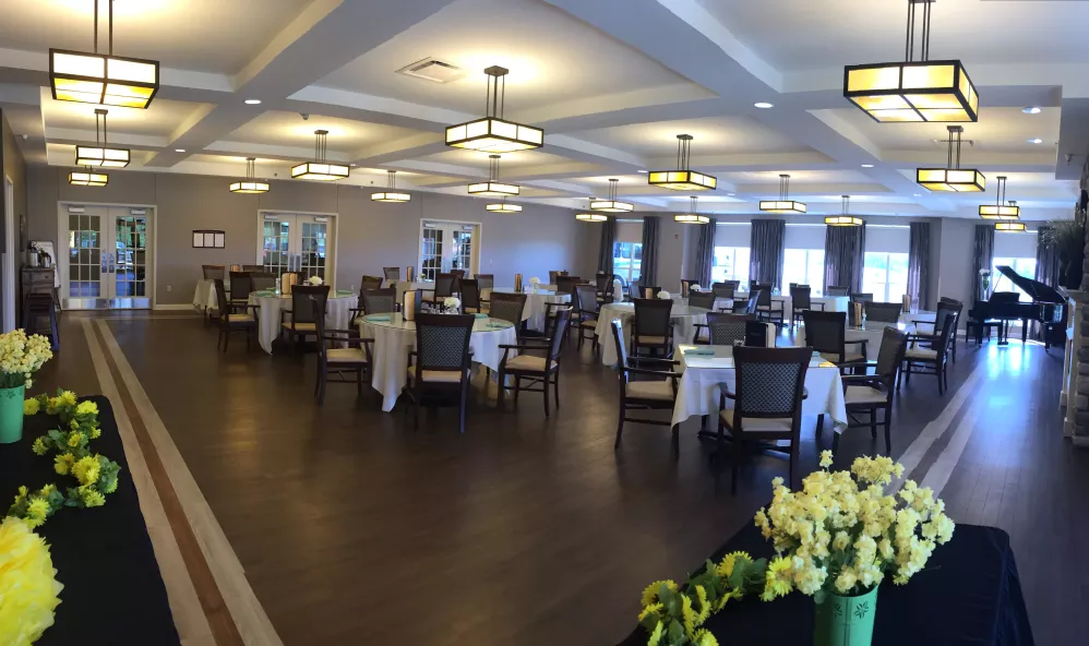 Interior view of a dining room with tables and chairs