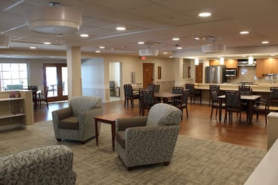 Bright common area with seating and dining space