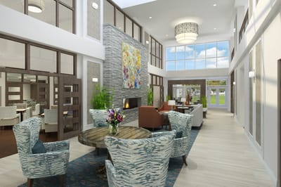Well-lit interior common area with seating and artwork