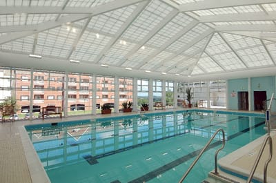 Indoor swimming pool with large windows