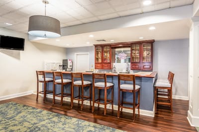 Common area bar with seating and stylish decor