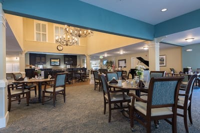 Dining area with tables and chairs in a lounge setting