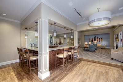Spacious common area with seating and bar