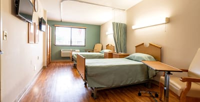 Interior view of a shared resident room with two beds