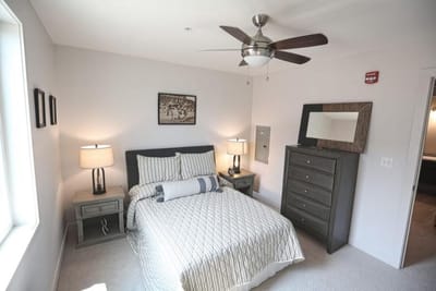A well-decorated private bedroom in a senior living facility