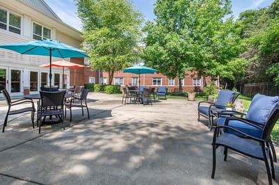 Outdoor lounge area with tables and chairs