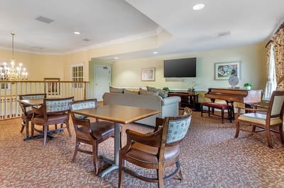 Comfortable common area with seating and piano