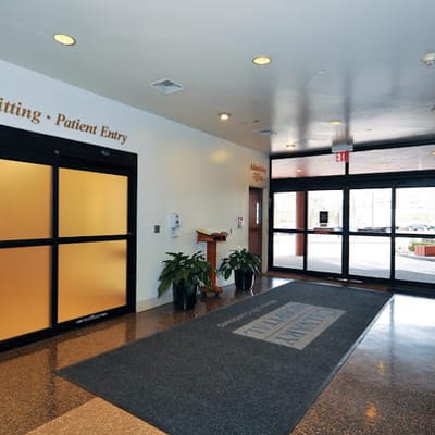 Entrance area with plants and patient entry signage
