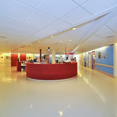 Interior view of a nursing station with staff.