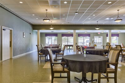 Dining area with tables and chairs in a bright interior