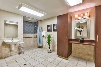 Spacious and well-lit bathroom in a senior living facility