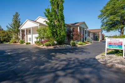 Exterior view of Countryside Manor building and driveway