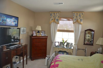 Cozy bedroom with floral decor and personal mementos