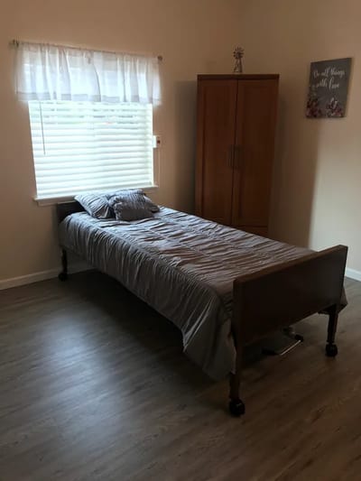 Private resident room with a bed and window