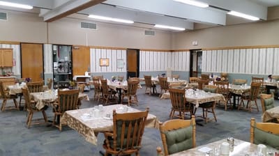Dining room with tables set for meals