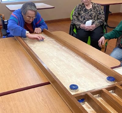 Residents participating in a game indoors
