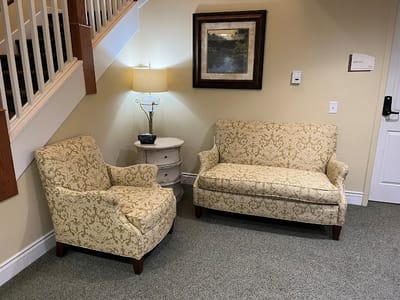 Cozy seating area with sofas and a lamp