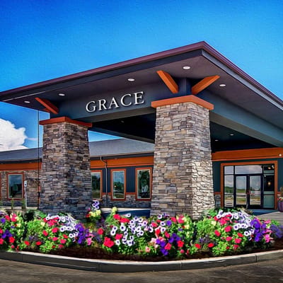 Exterior of the Grace Assisted Living facility with flowers