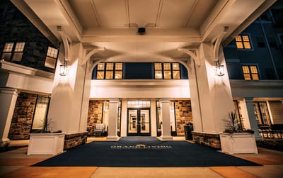 Exterior view of Grand Living at Indian Creek entrance at night