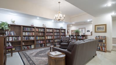 A cozy library area with bookshelves and seating