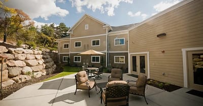 Outdoor patio area with seating and landscaping