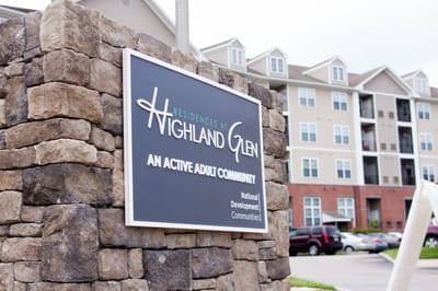 Signage for Highland Glen Apartments and building exterior