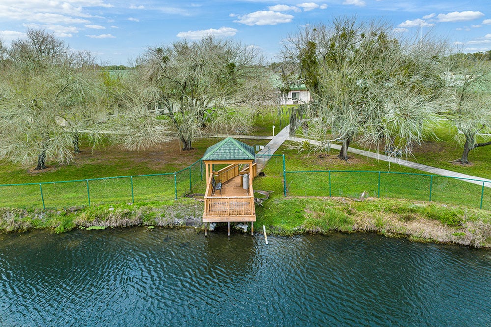 Outdoor gazebo by a tranquil waterway