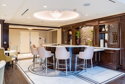 Bright lounge area with a bar and seating
