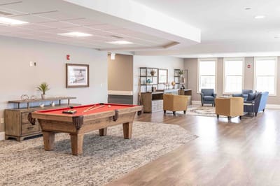 Interior common area with a pool table and seating