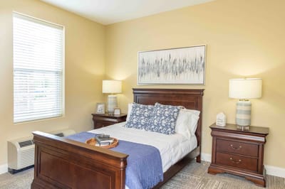Well-furnished private bedroom in a senior care facility