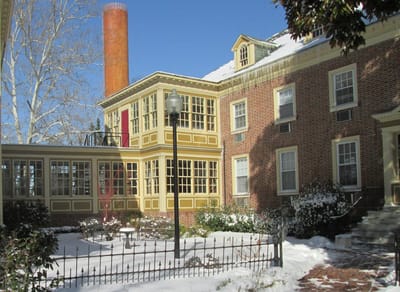 Exterior view of the assisted living facility covered in snow