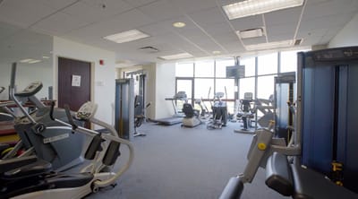 Well-equipped fitness room with exercise machines
