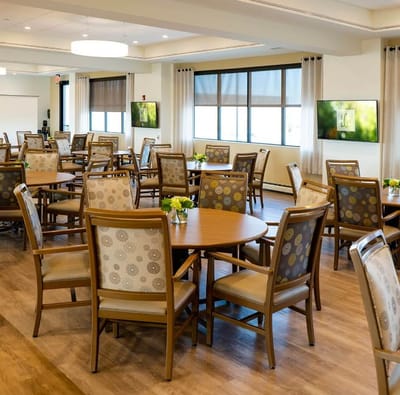 Bright dining room with wooden tables and chairs