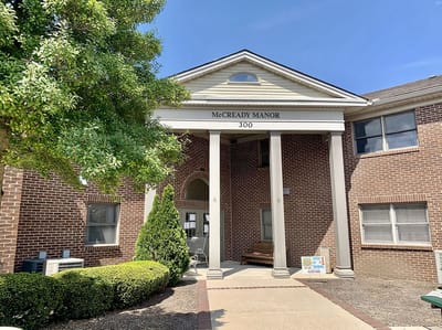 Exterior view of McCready Manor with entrance and landscaping