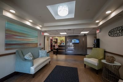 Bright lobby area with comfortable seating and a welcome desk