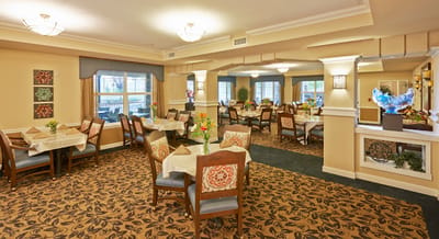 Bright dining area with tables and chairs