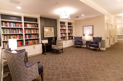 Cozy reading area with bookshelves and seating