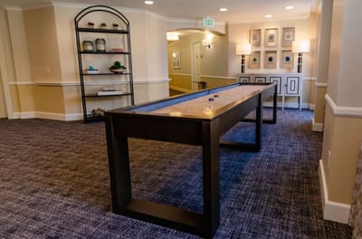 Interior common area with a gaming table