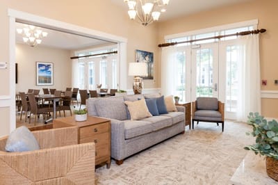 Bright common area with comfortable seating and dining space