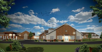Exterior view of the facility building with landscaped grounds
