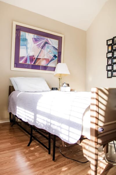 Cozy resident bedroom with artwork and natural light