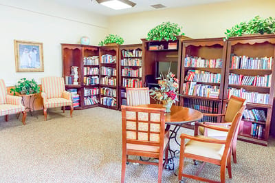 Cozy common area with bookshelves and seating