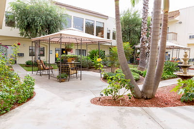 Outdoor garden area with seating and umbrellas