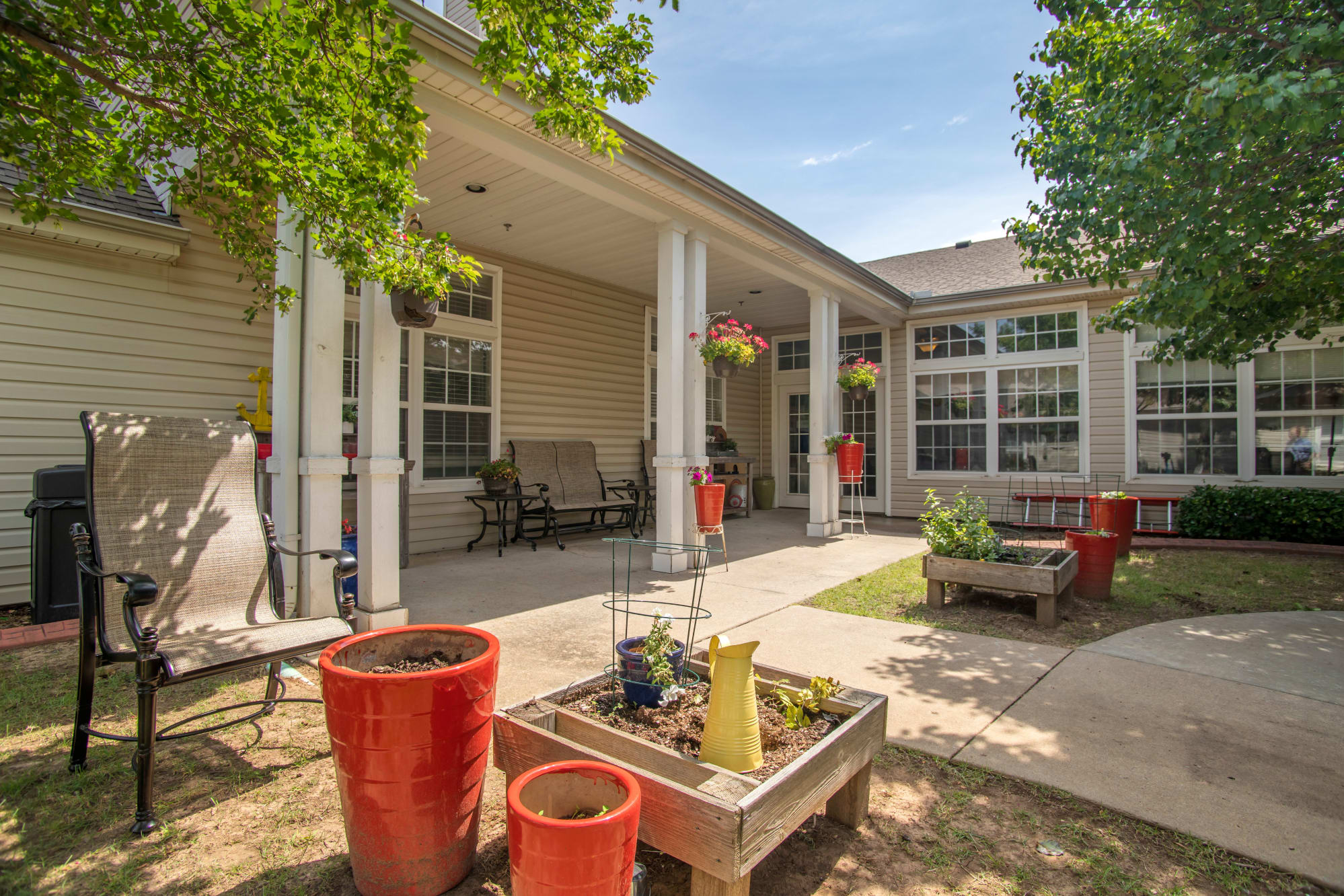 Outdoor space with seating and flower pots