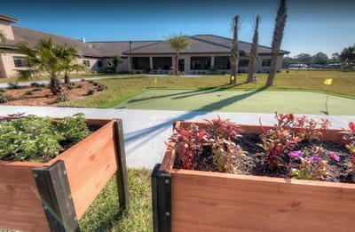 Outdoor garden area with planters and putting green