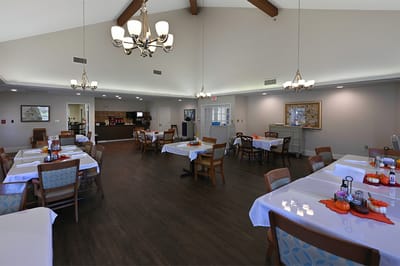 Dining room setup with tables and decorations