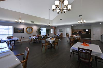 Dining room with tables set for residents
